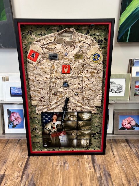 A white truck is parked in a parking lot next to a building.
