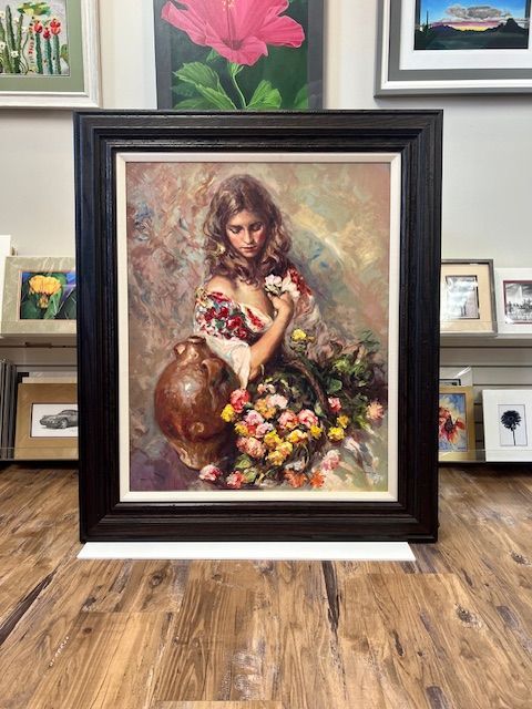 The inside of a moving truck filled with boxes and blankets.