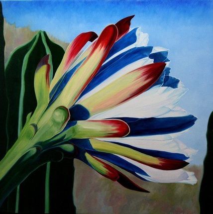 A white truck is parked in a parking lot next to a building.