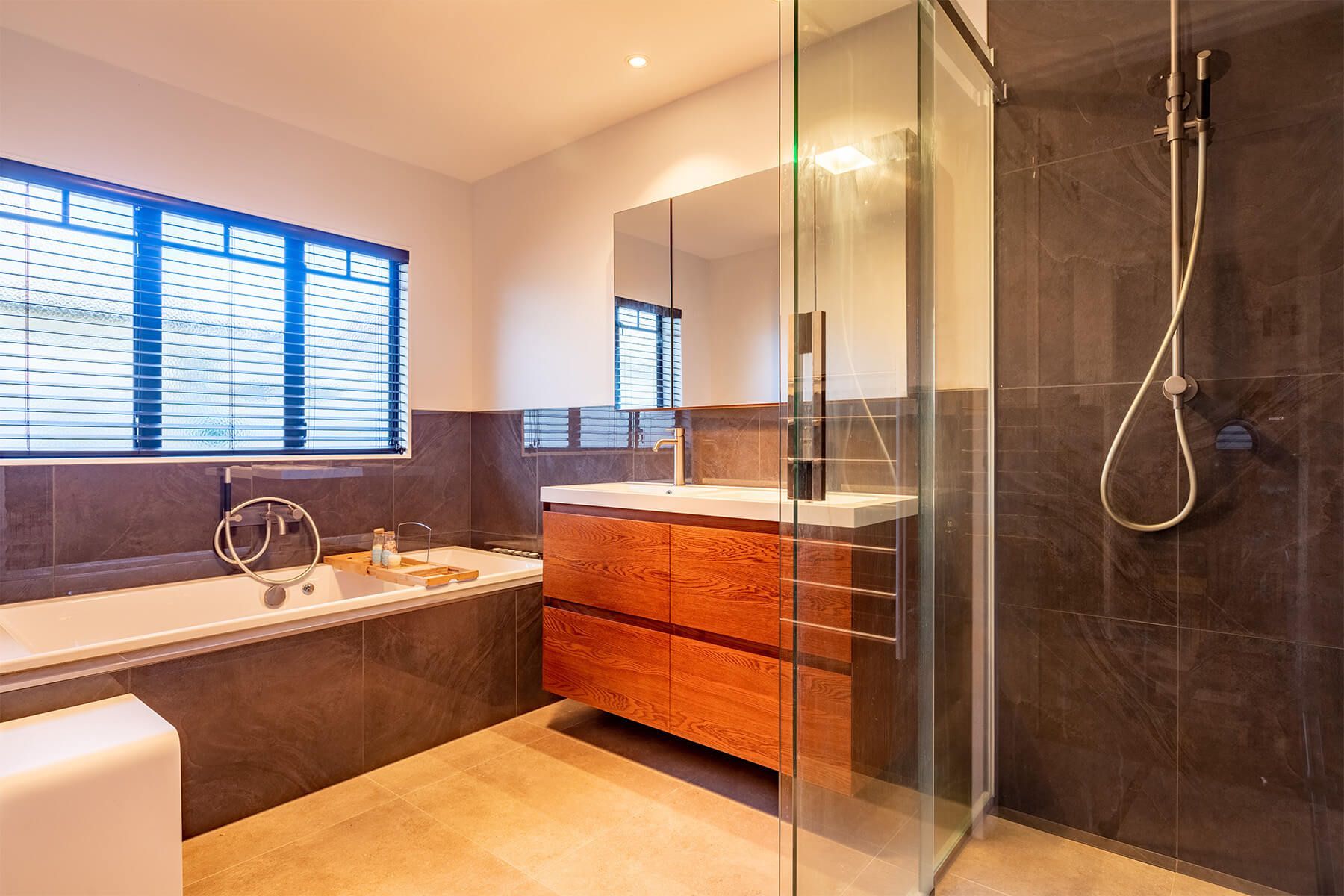 elegant tiled bathroom with double vanity