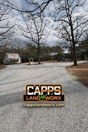 Gravel driveway with trees and a small house, Capps Land Worx logo and website at bottom