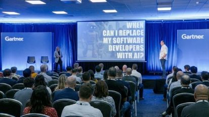 Patient Zero Co-CEOs Paul Seymour and Demelza Green on stage at Gartner IT Symposium, presenting on the future of AI-augmented software engineering