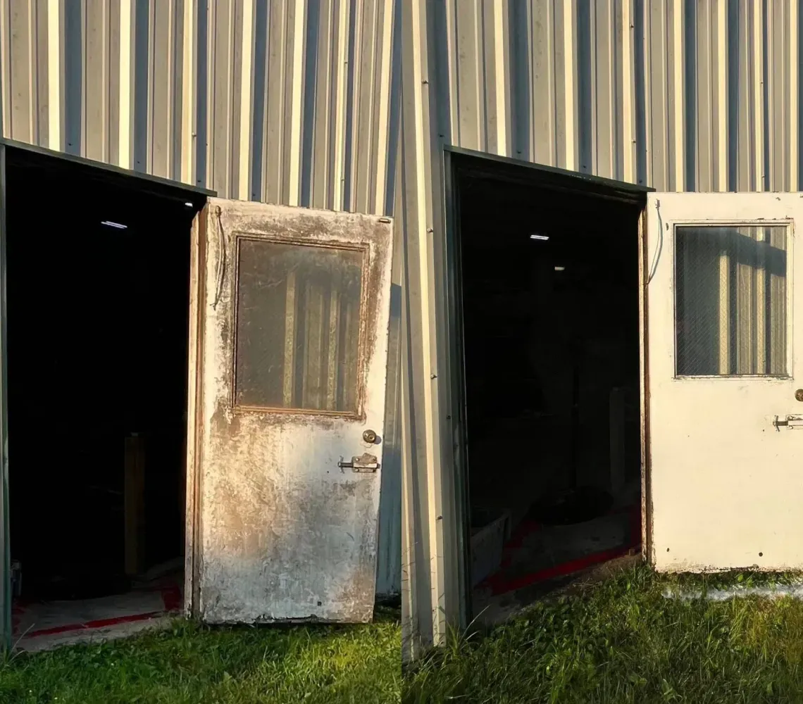 Before and after comparison of a dirty, weathered metal door being cleaned to look bright and new on a workshop exterior.
