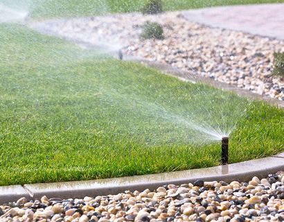 Sprinklers watering grass