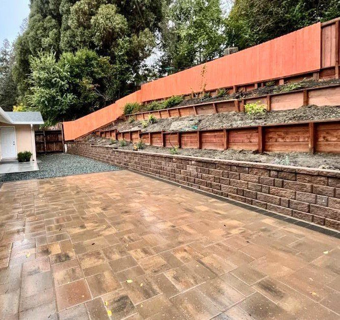 Concord backyard makeover with retaining wall and paver patio