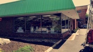 Store With Green Roof And Huge Glasses — Knoxville, TN — Glass Pros Knoxville