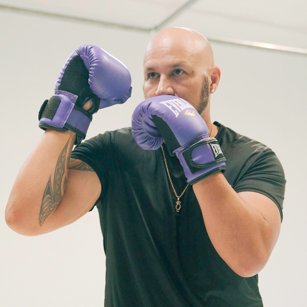 Quintin Wakefield wearing purple everlast boxing gloves