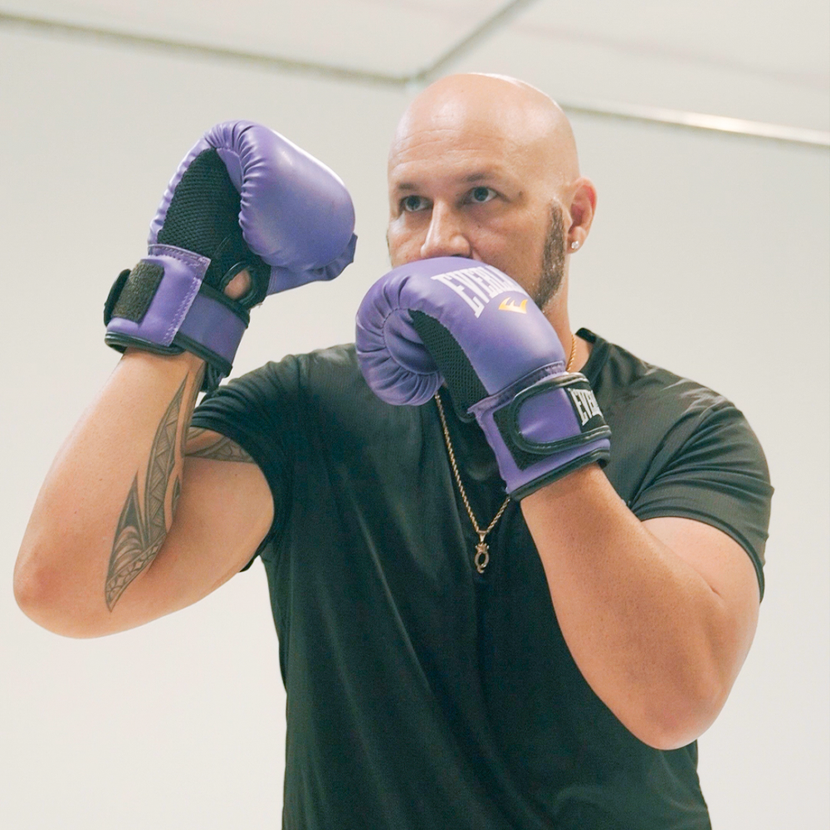 Quintin Wakefield wearing purple everlast boxing gloves