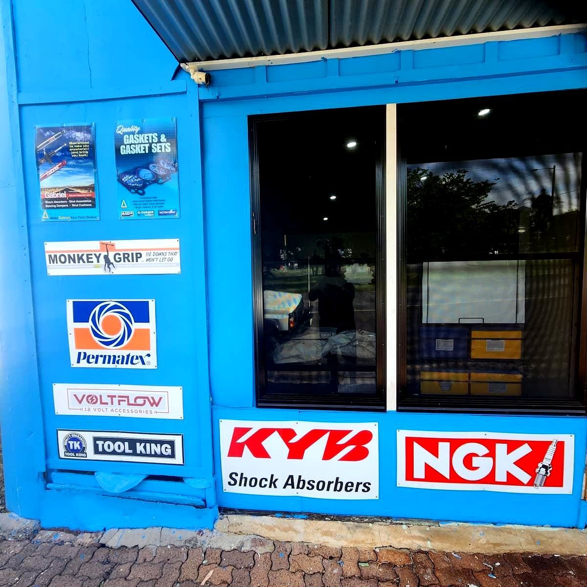 A Blue Building With Multiple Signs  — Murgon Auto Parts & Outdoors In Murgon, QLD