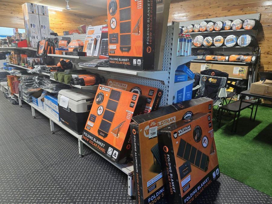 A Store Filled With Lots of Products Including Boxes of Solar Panels — Murgon Auto Parts & Outdoors in Murgon, QLD