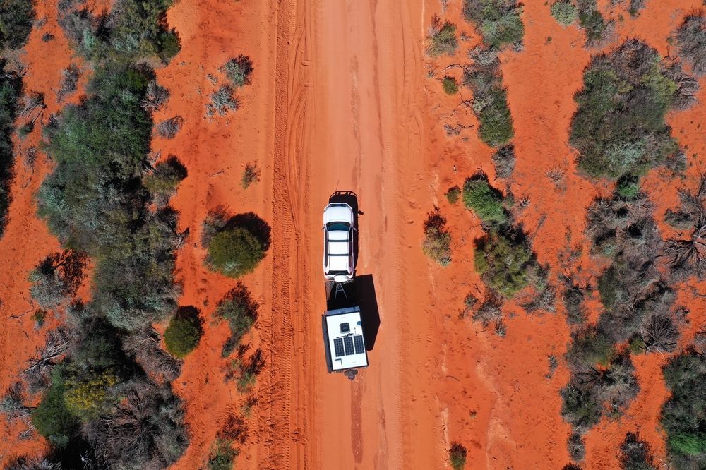 A Black Jeep is Parked on Top of a Dirt Hill — Murgon Auto Parts & Outdoors in Murgon, QLD
