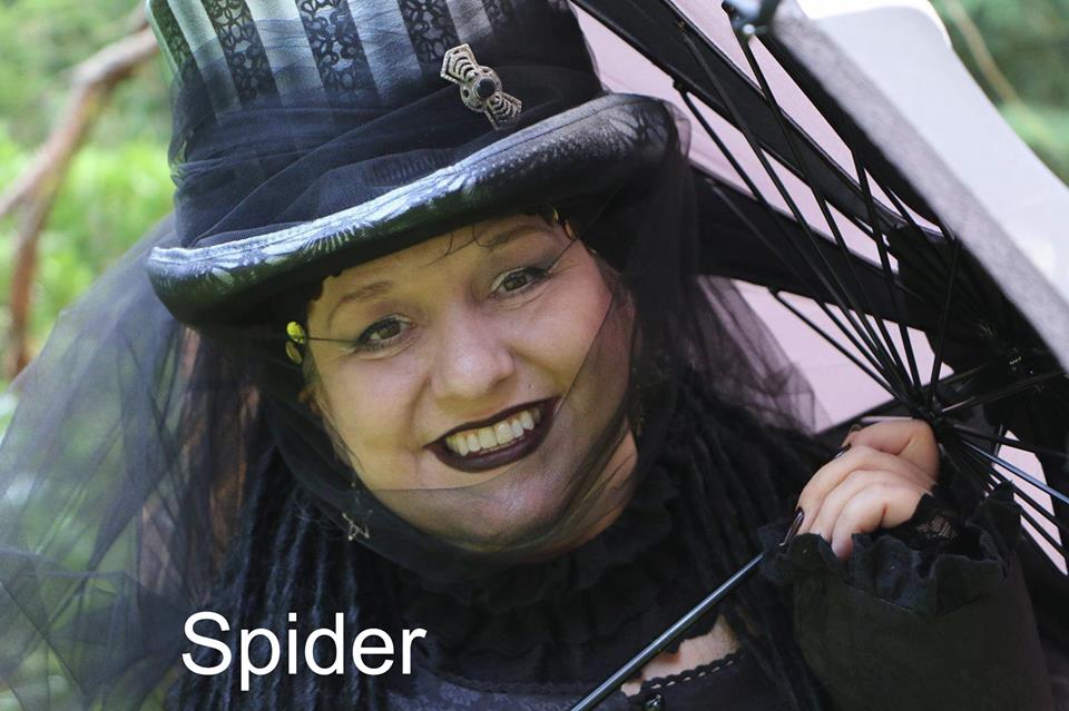A woman wearing a top hat and holding an umbrella is called spider, Belladonna LaVeau.