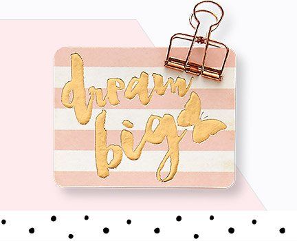 A pink and white striped card with the words `` dream big '' written on it.
