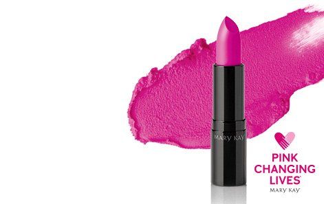 A pink lipstick is sitting next to a pink lipstick swatch.