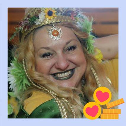 A woman is wearing a crown of flowers on her head and smiling, Belladonna Laveau.