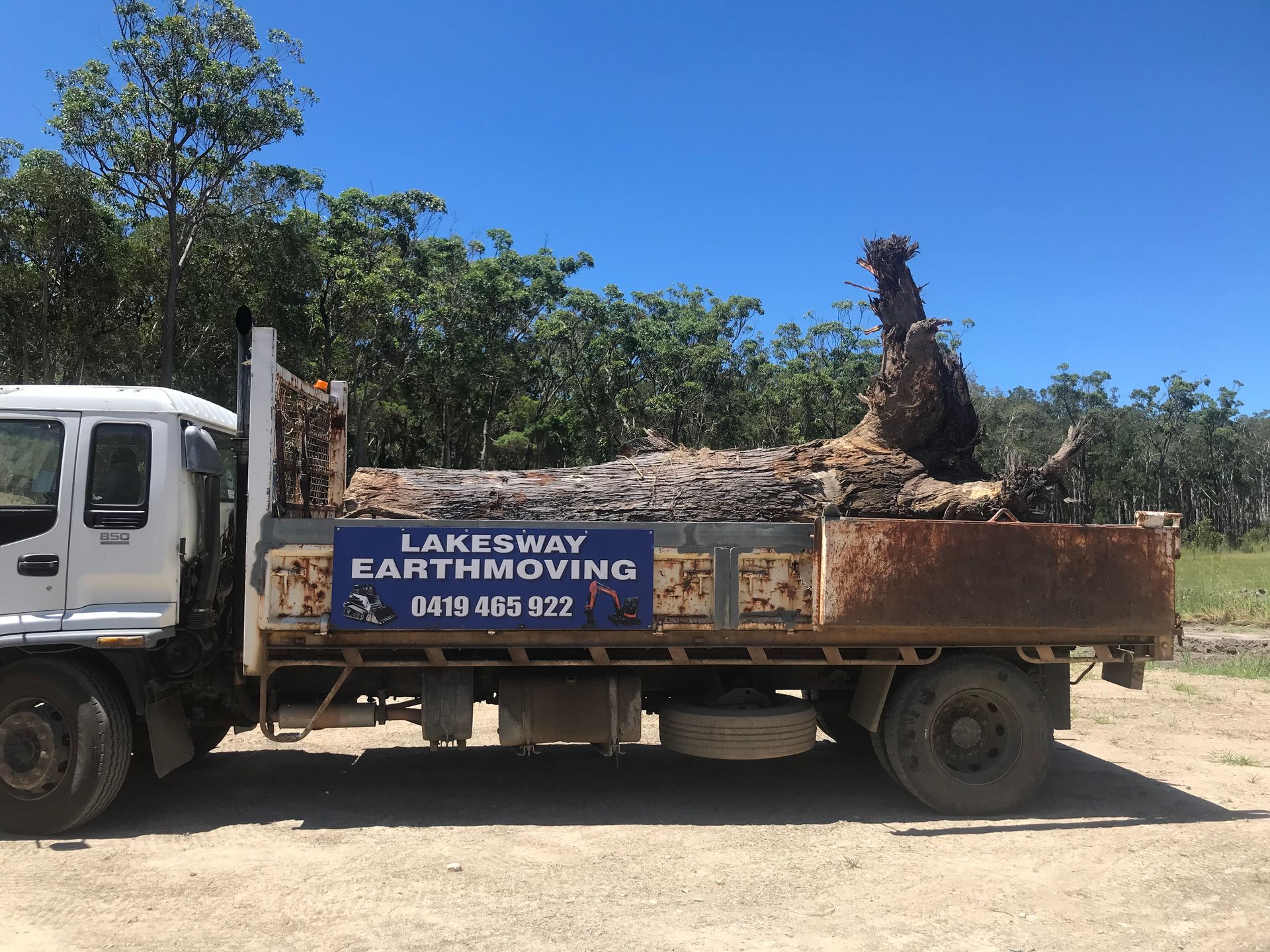 Truck bed filled with dirt and tree debris — Lakesway Earthmoving in Bulahdelah, NSW