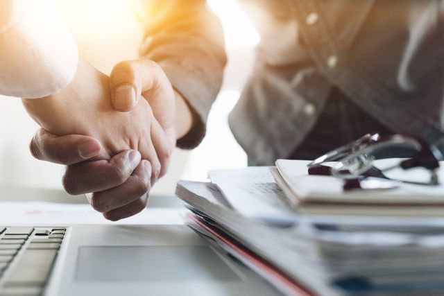 Lawyer and Client Shaking Hands — Livonia, MI — Charles J Schneider PC
