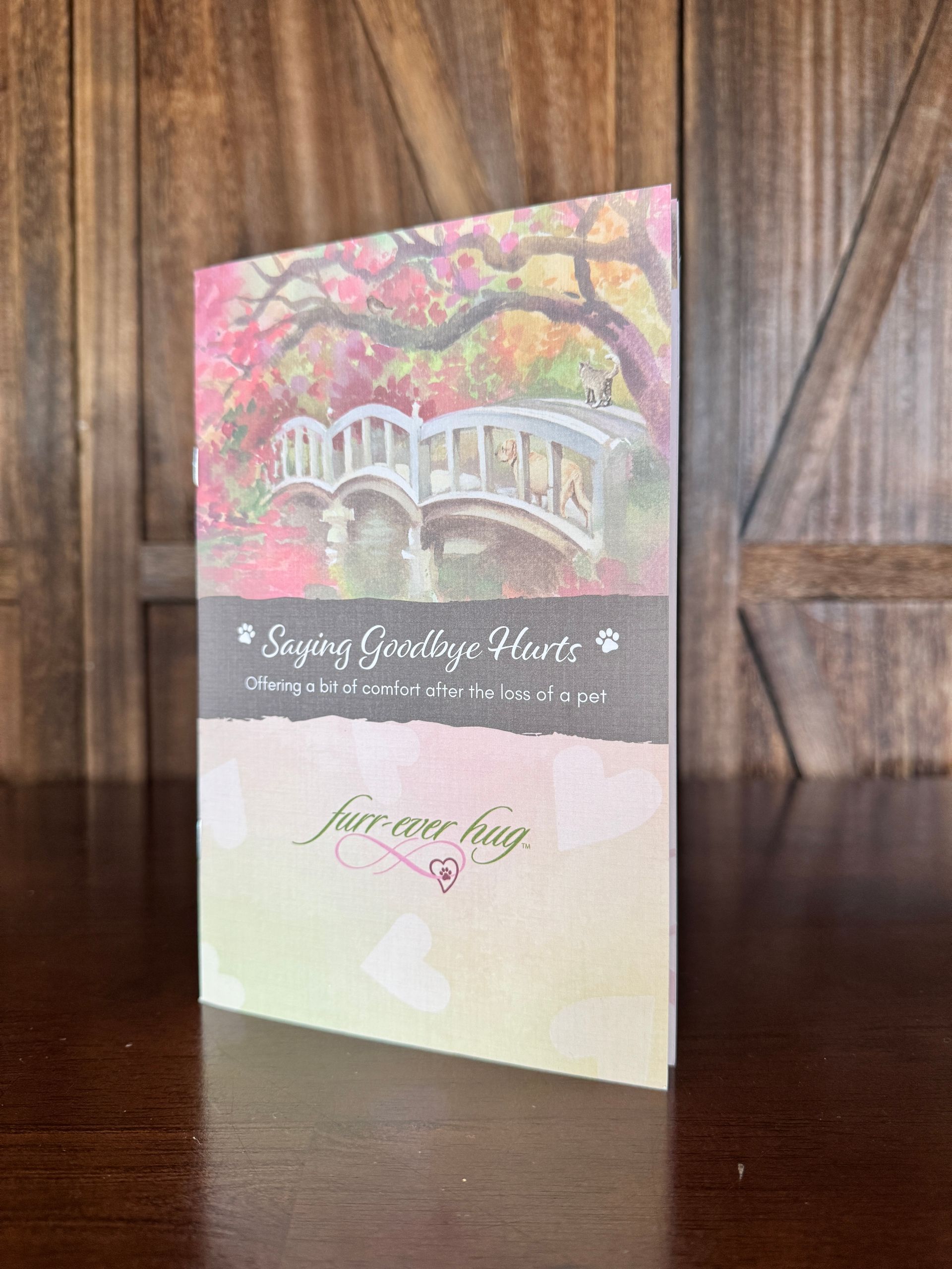 Card with bridge and pink foliage, text: Saying Goodbye, Forever loving.