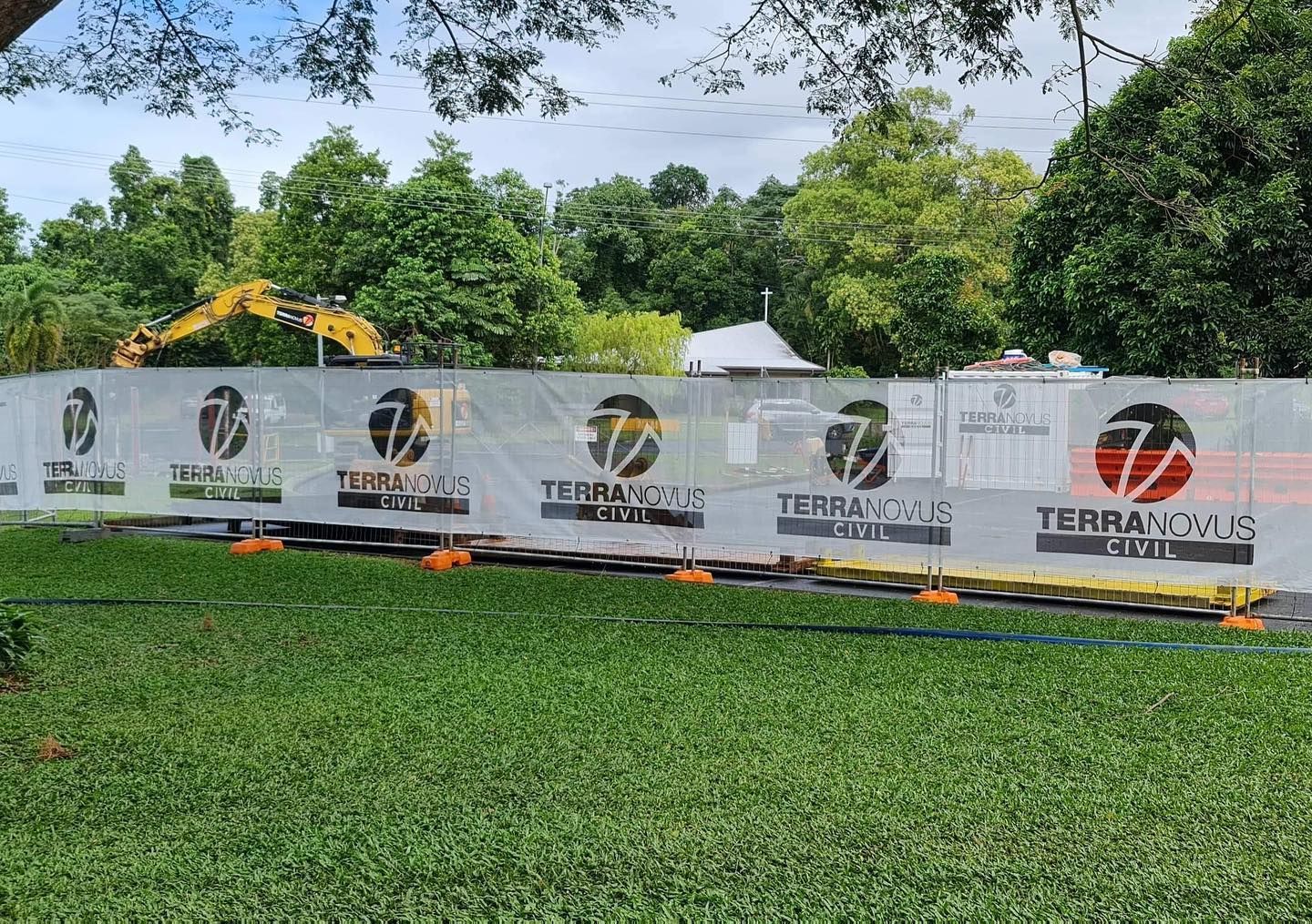 Construction Site Behind a Fence With the Terranova Logo — Terranovus Earthworks & Plant Hire in Far North, QLD