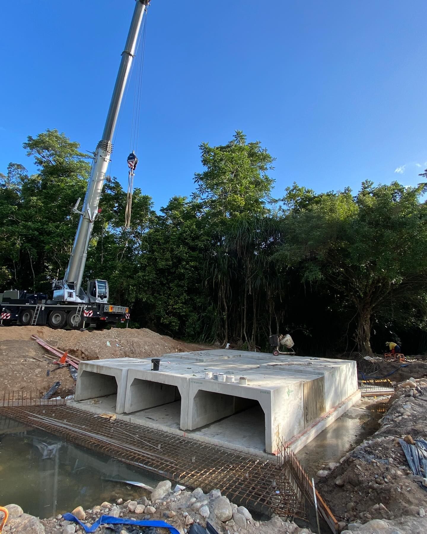 Crane Lowering a Concrete Culvert Structure — Terranovus Earthworks & Plant Hire in Far North, QLD