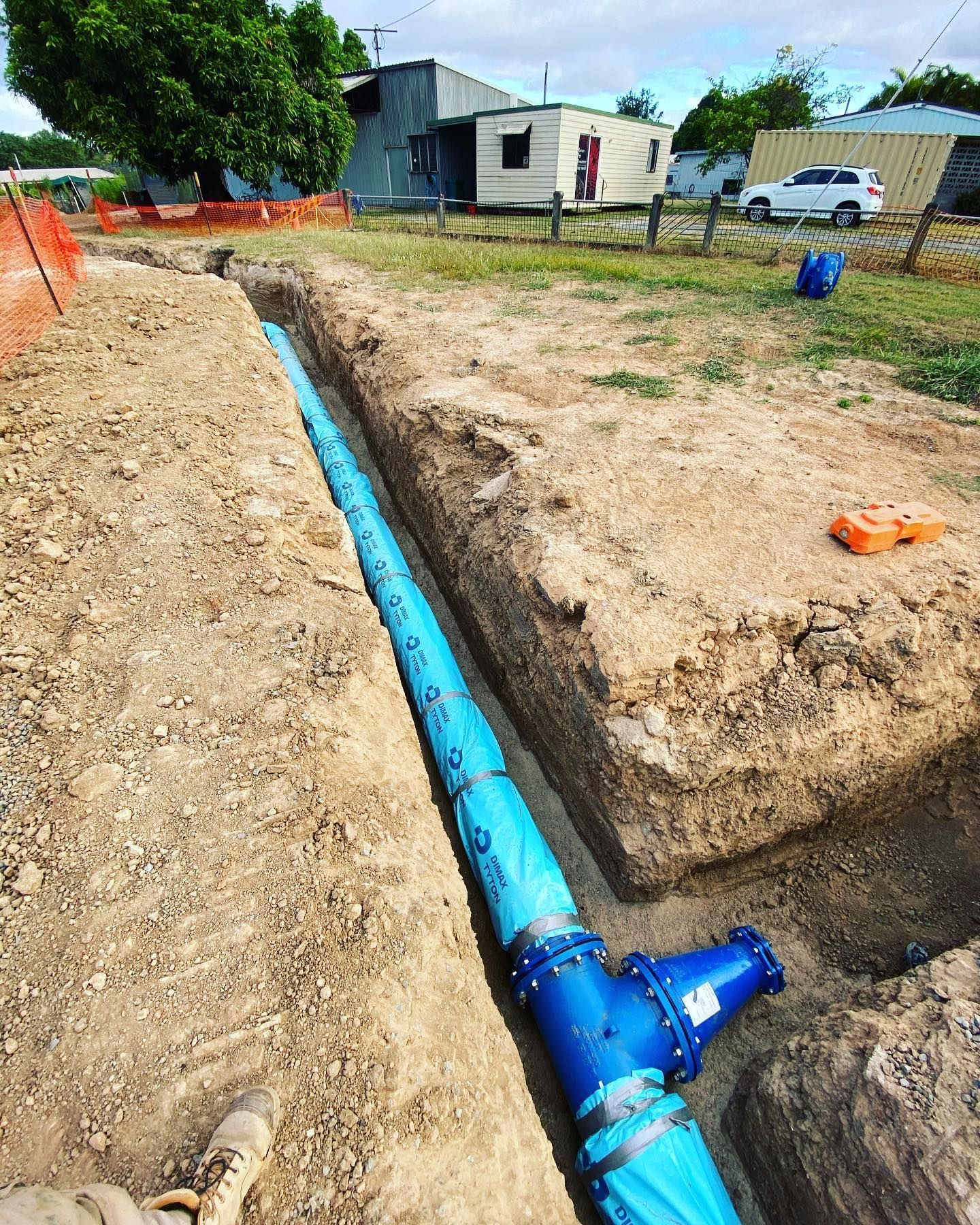 Blue Water Pipe Installed in a Trench on a Construction Site — Terranovus Earthworks & Plant Hire in Tablelands, QLD