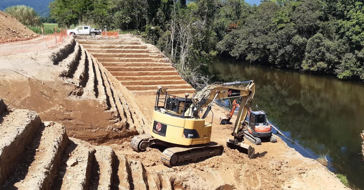Excavators on a Riverbank During Construction — Terranovus Earthworks & Plant Hire in Cairns City, QLD