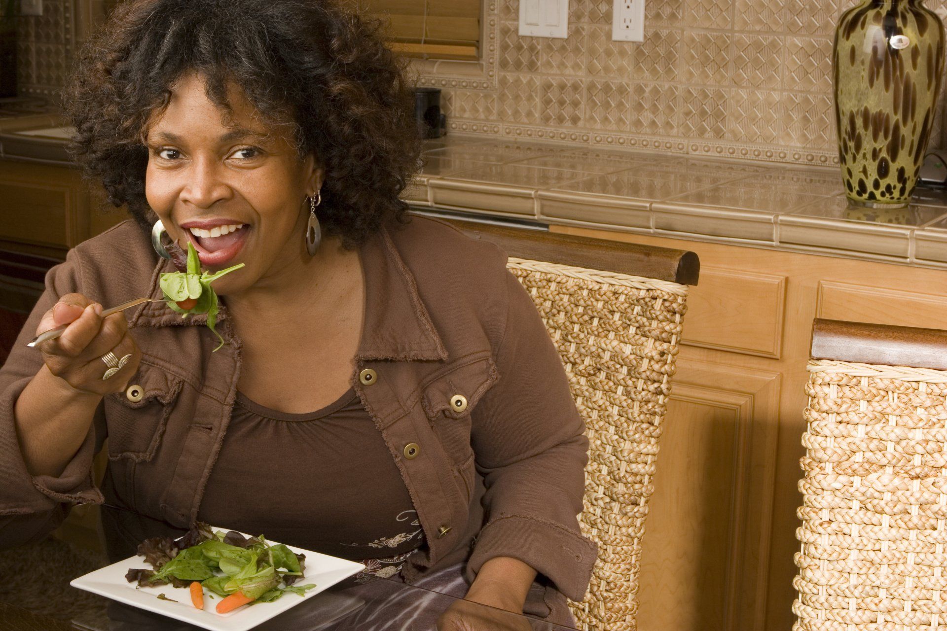 woman eating salad