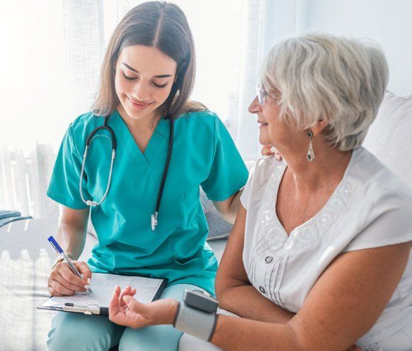Older Person having Blood Pressure Checked — Benton County Health Department — Warsaw, MO