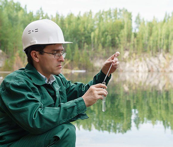 Industrial Ecologist Takes a Sample of Water — Benton County Health Department — Warsaw, MO