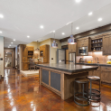 There is a large island in the middle of the kitchen.