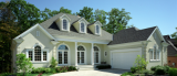 A large white house with a garage and a driveway in front of it.