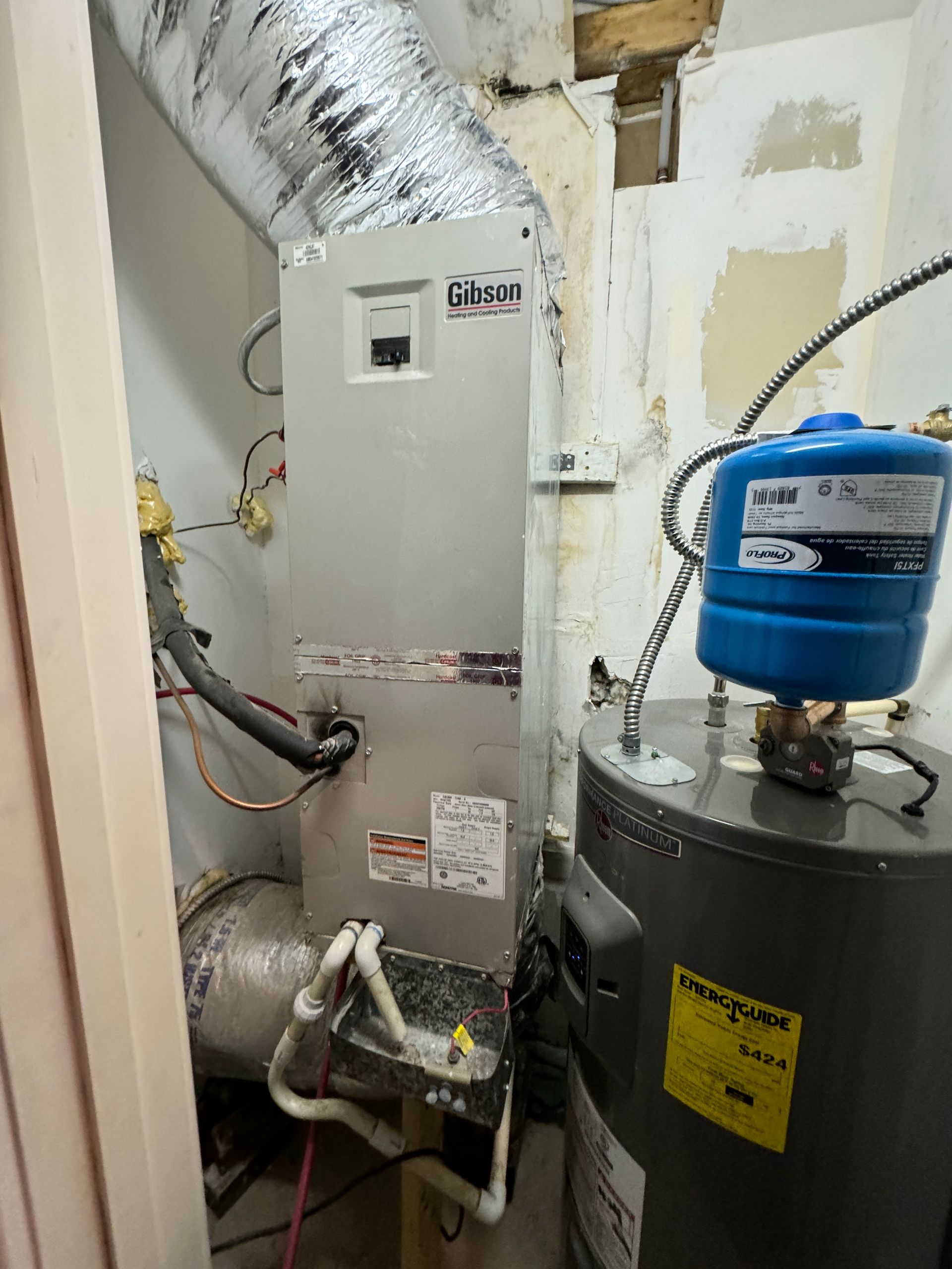 A kitchen with a granite counter top and a refrigerator.