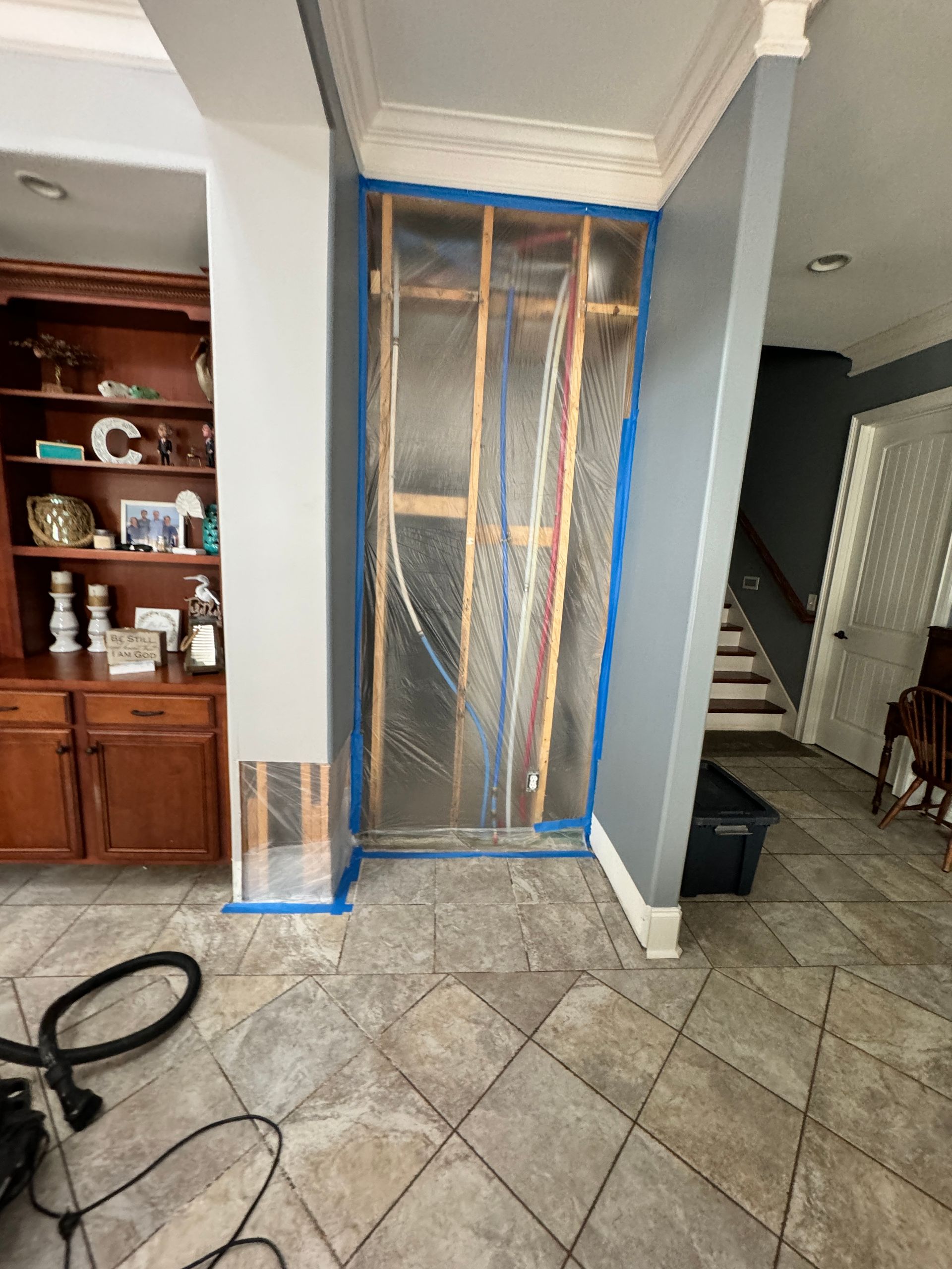 A bathroom with a sink , toilet , shower and mirror.