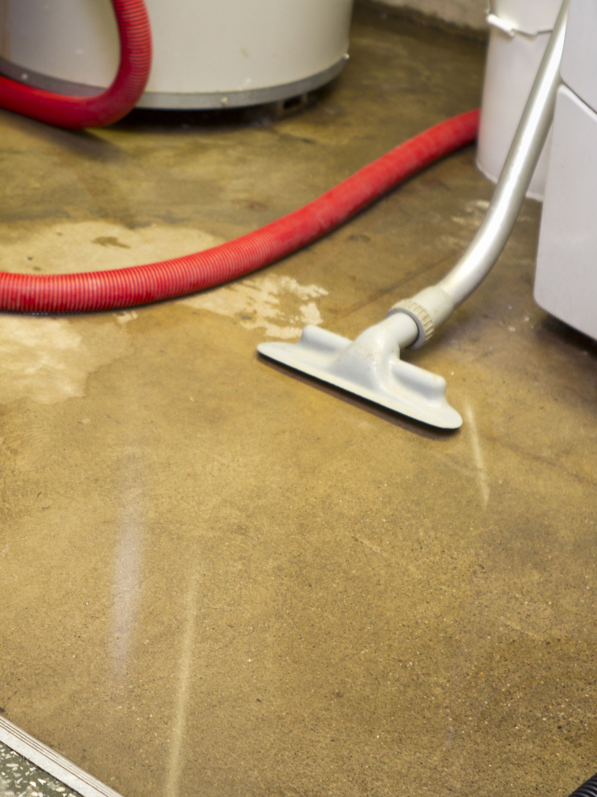 A vacuum cleaner is being used to clean a dirty floor. A vacuum cleaner is being used to clean a dirty floor.