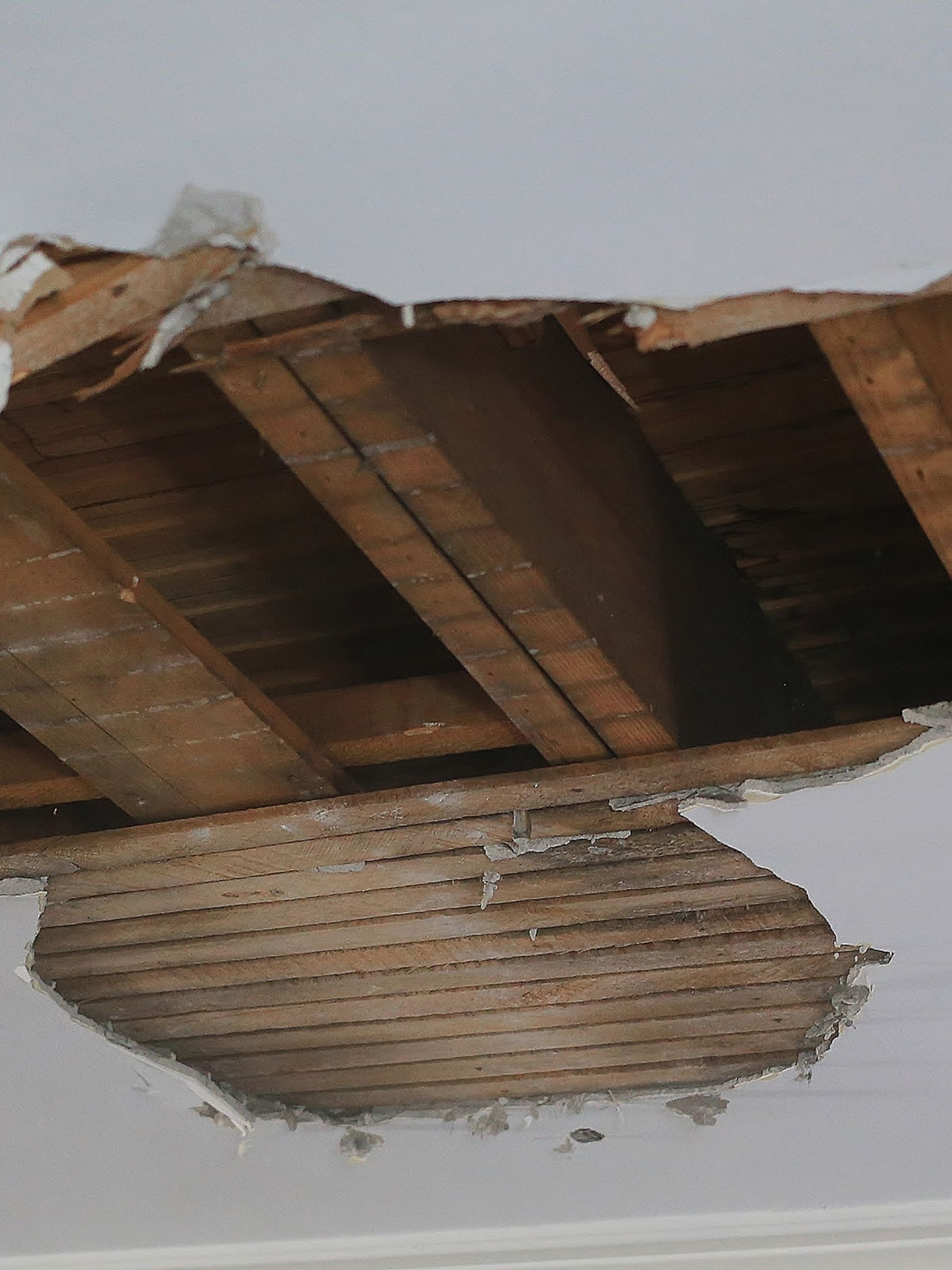 A hole in the ceiling of a building A hole in the ceiling of a building