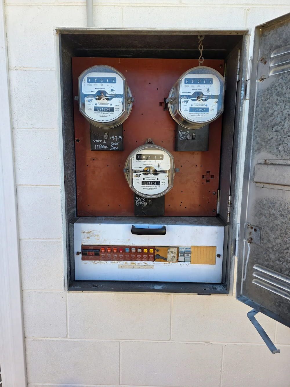 Electric Meters and Breakers in a Metal Enclosure — BNS Refrigeration Services in Healy, QLD