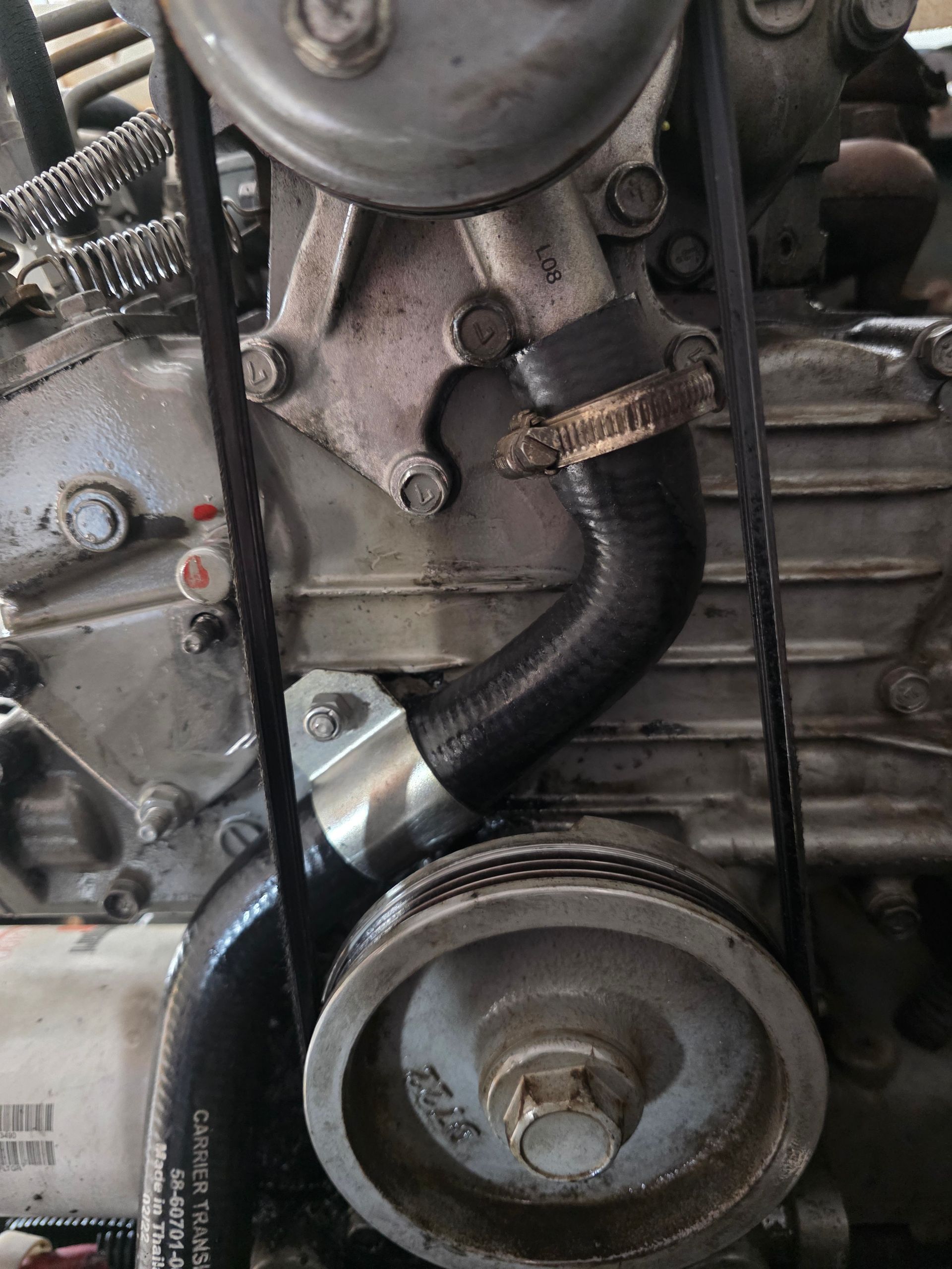 Engine With Pulley, Belts, and a Curved Hose — BNS Refrigeration Services in Healy, QLD