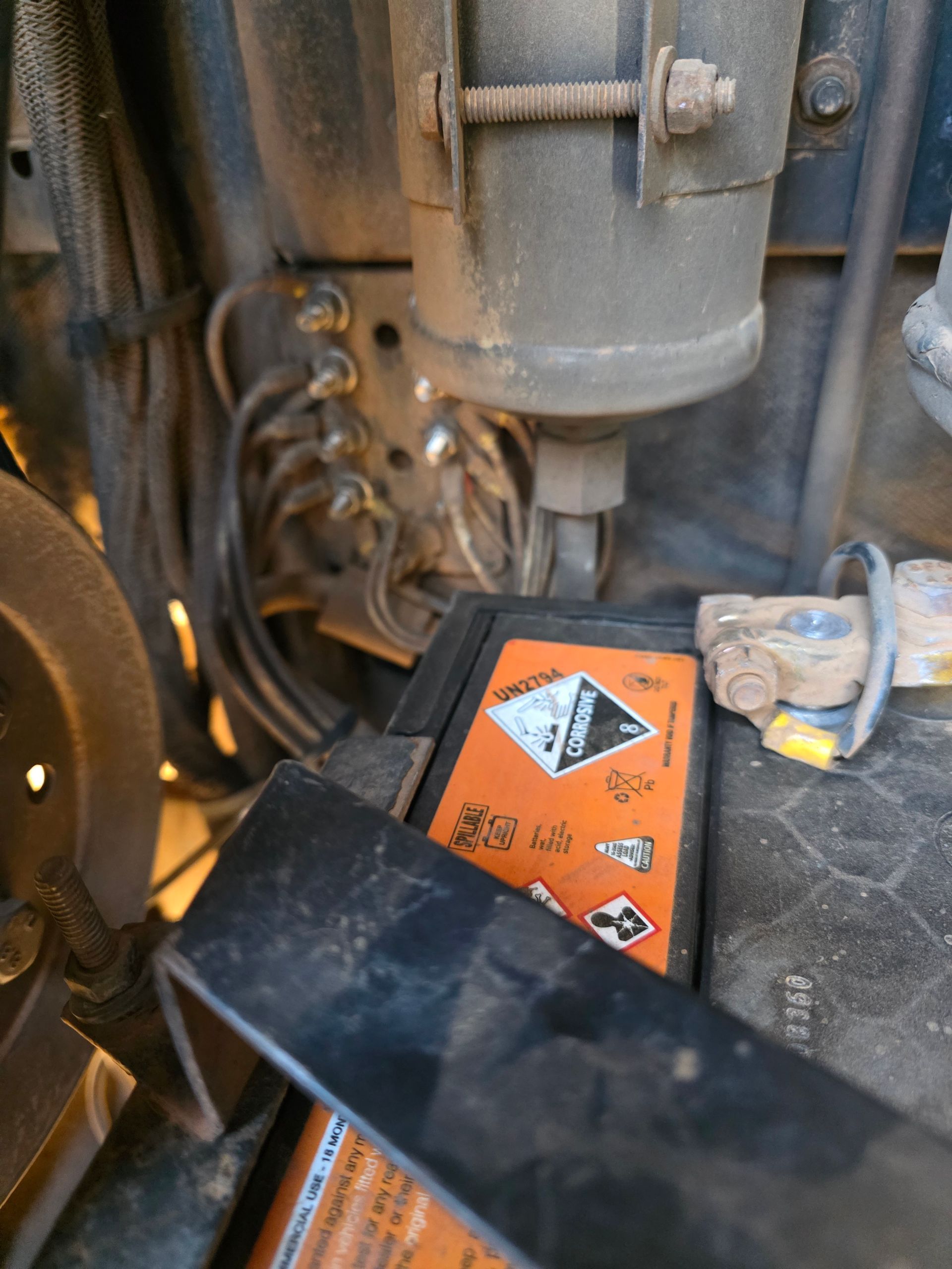 Orange Hazard Sign on a Battery — BNS Refrigeration Services in Healy, QLD