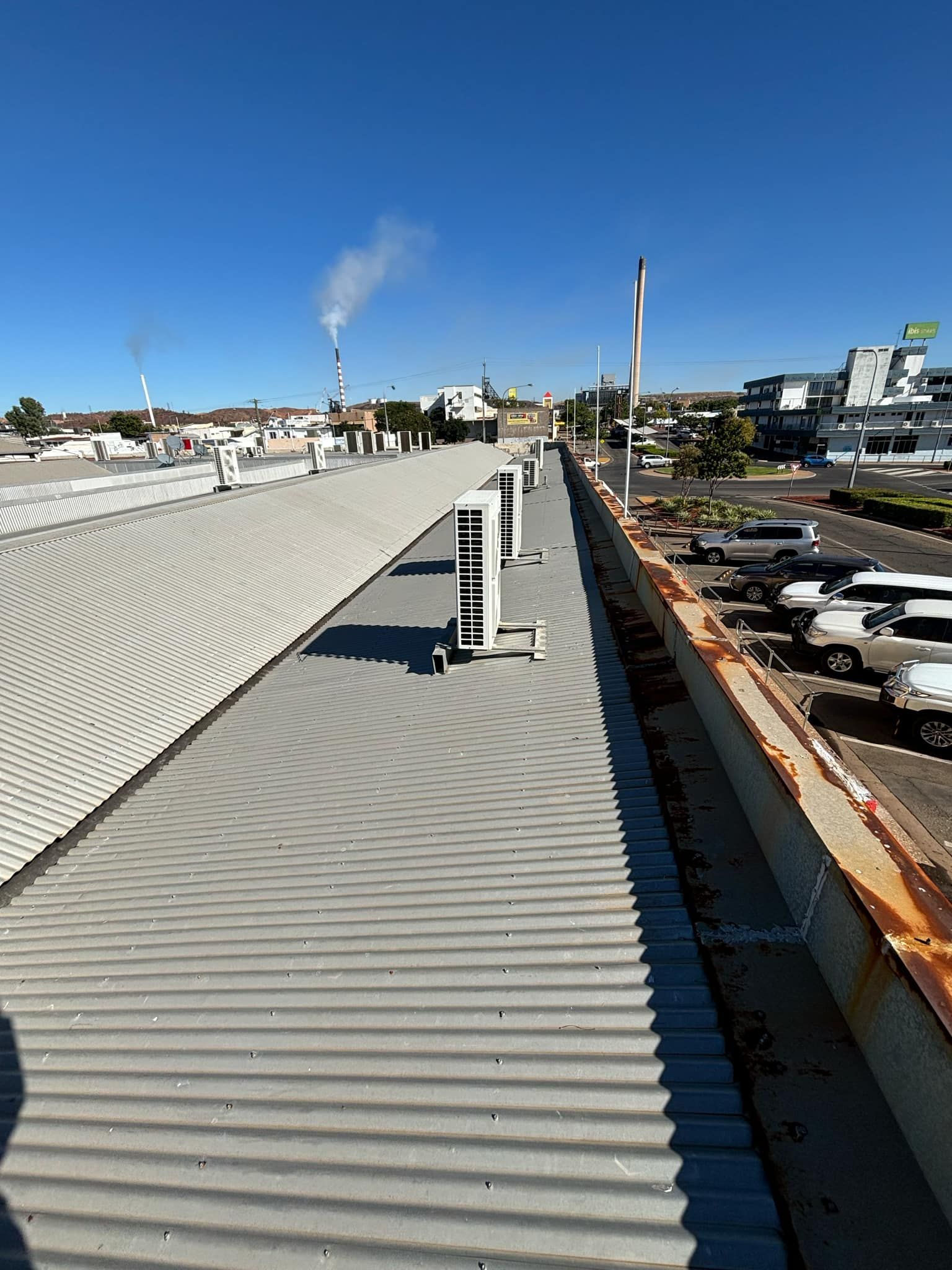 Overhead View of a Corrugated Metal Roof With Hvac Units — BNS Refrigeration Services in Healy, QLD