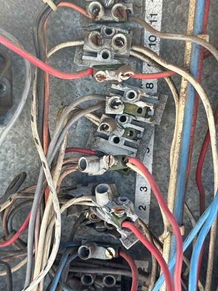 Close-up of Electrical Wiring Connections in a Metal Enclosure — BNS Refrigeration Services in Healy, QLD