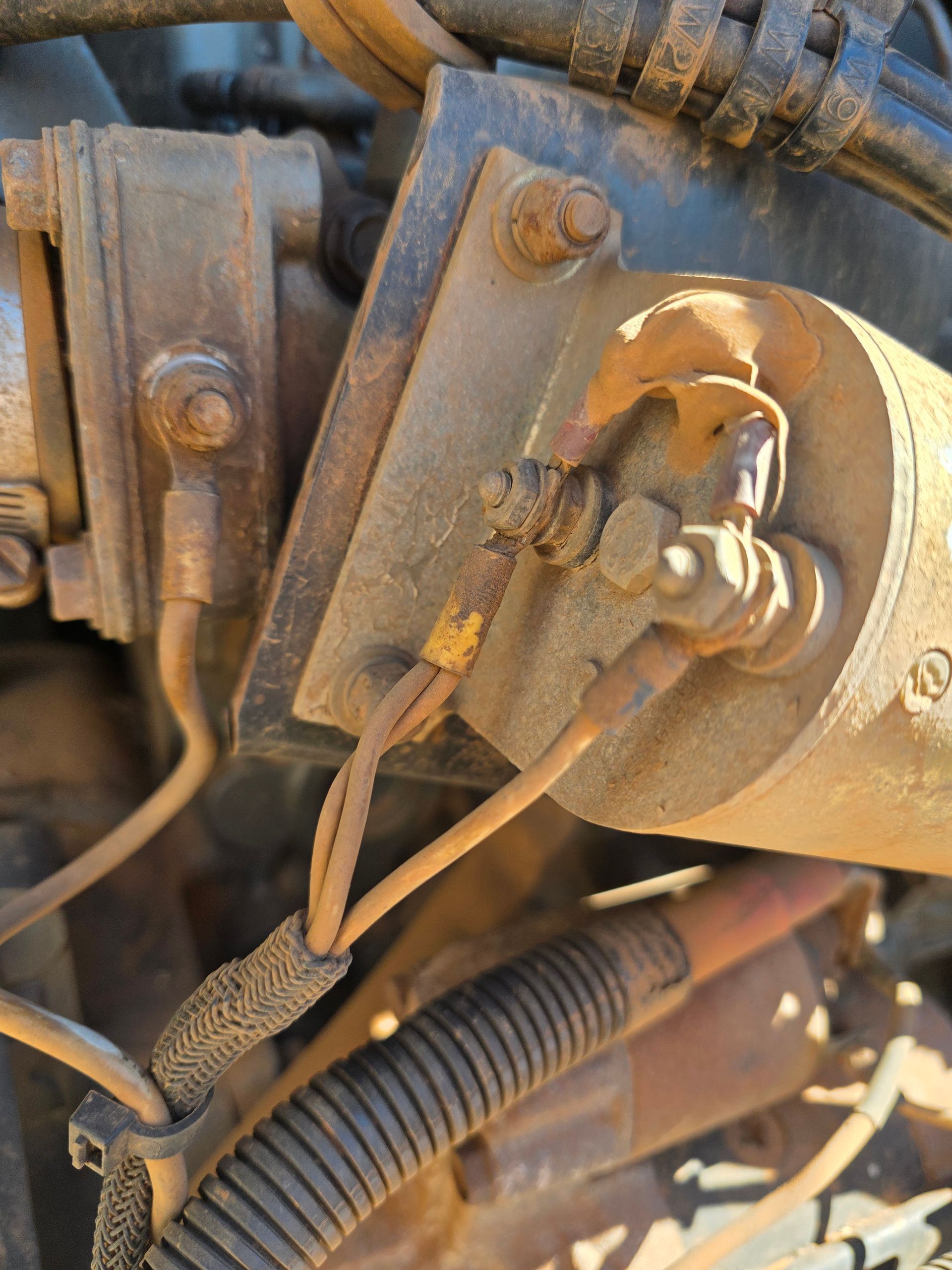 Close-up of a Rusty Starter Motor With Wiring Connected — BNS Refrigeration Services in Healy, QLD