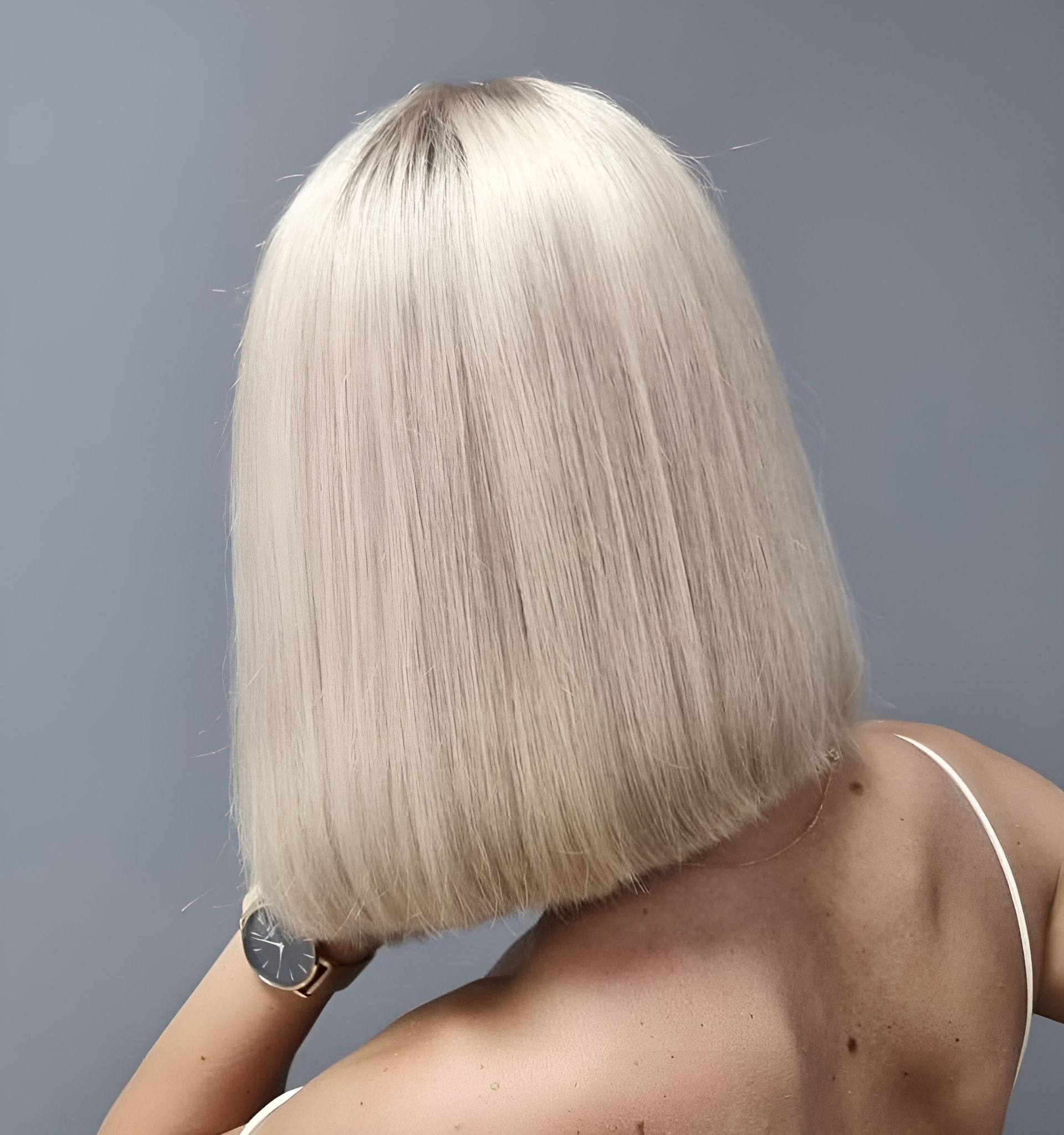 The Back Of A Woman's Blonde Straight Hair Is Shown In A Salon — Sophisticut Hair Salon in Mysterton, QLD