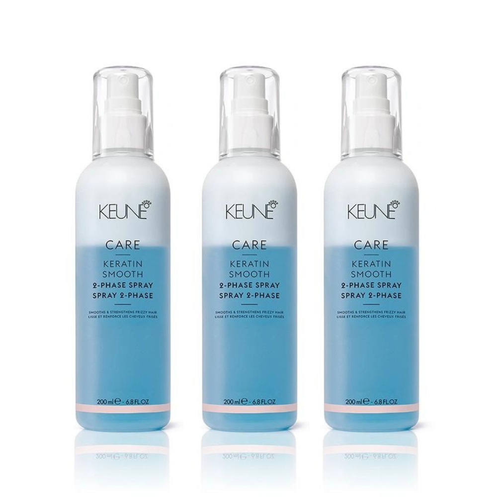 Three Keune Care Keratin Smooth D-Phase Spray & Rinse bottles, blue and white, on a white surface. — Sophisticut Hair Salon in Mysterton, QLD