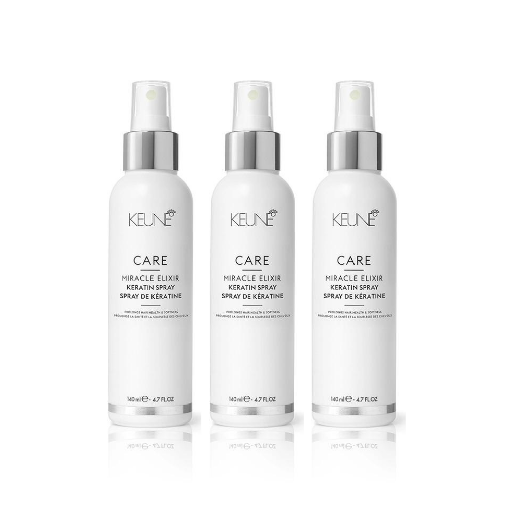 Three white Keune Care Miracle Elixir Keratin Spray bottles with silver spray tops. — Sophisticut Hair Salon in Mysterton, QLD