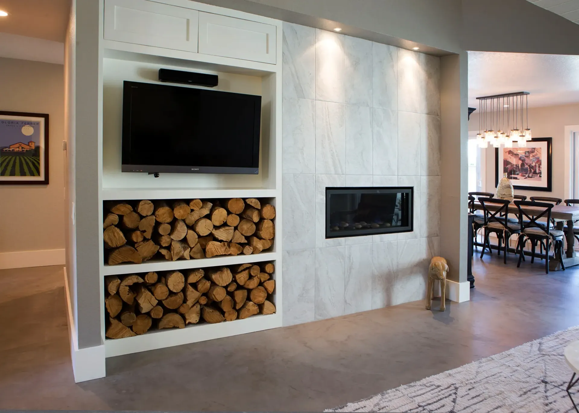 A living room with a fireplace and a flat screen tv