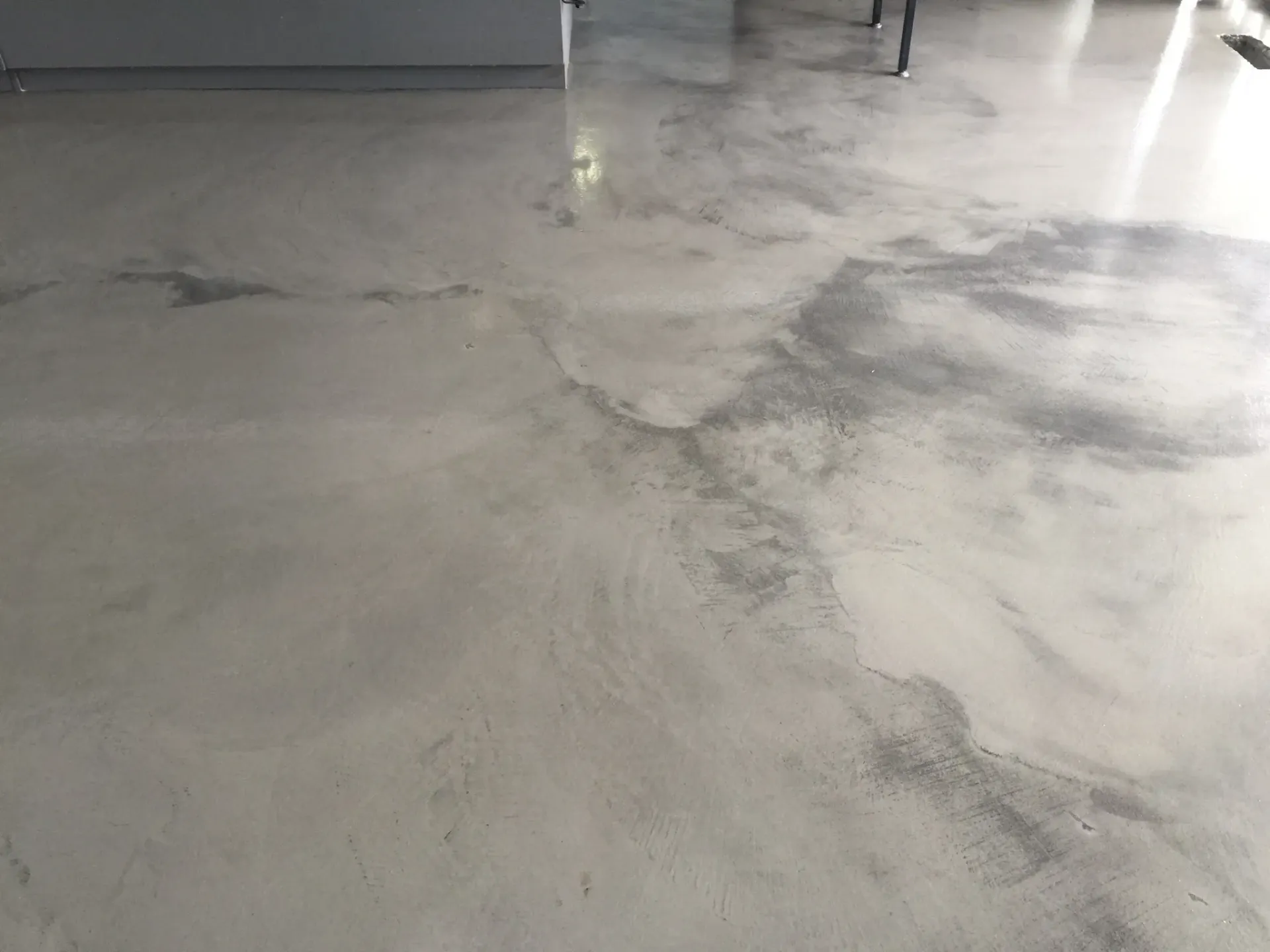 A close up of a concrete floor in a room.