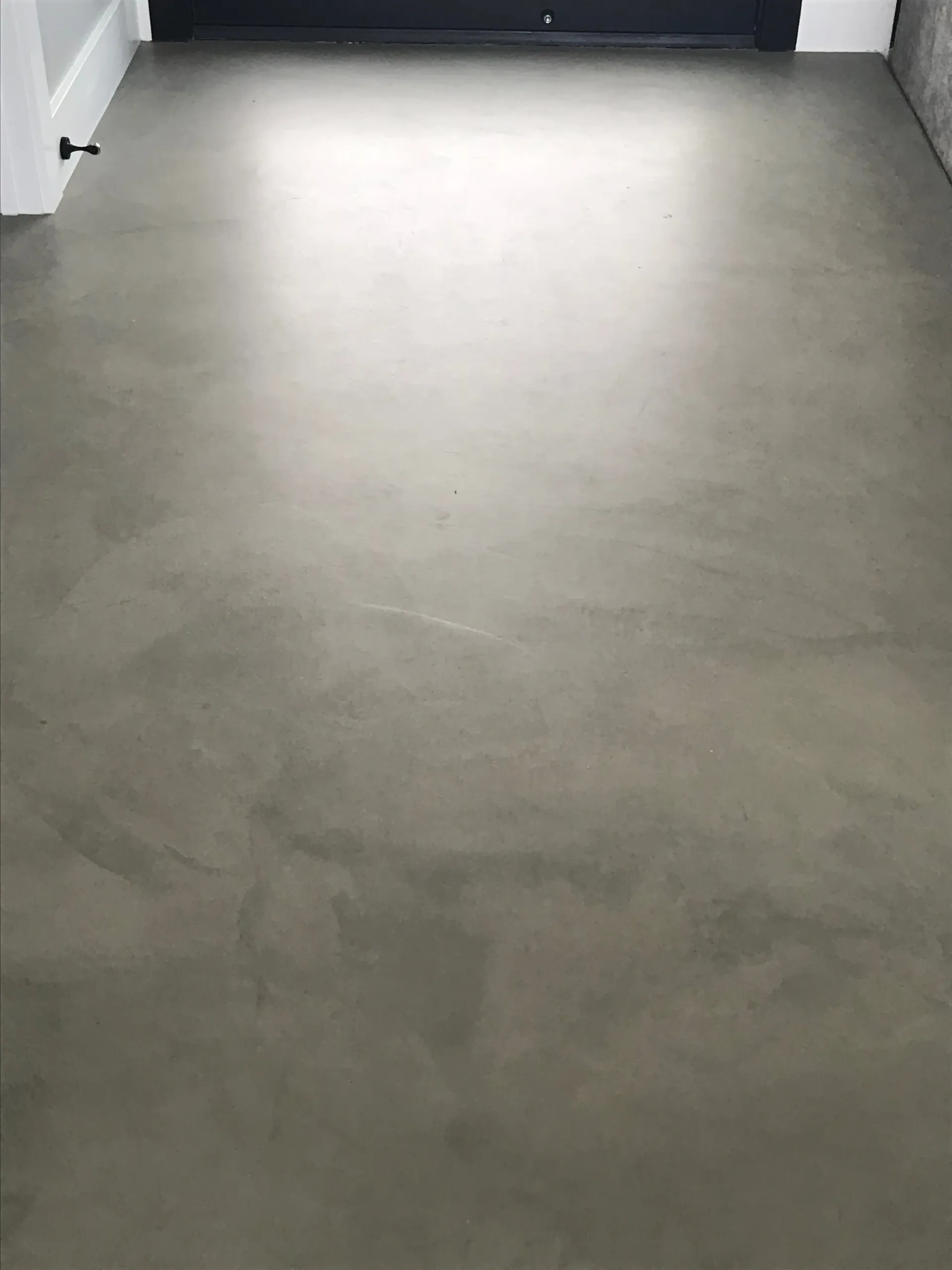 A close up of a concrete floor in a room.