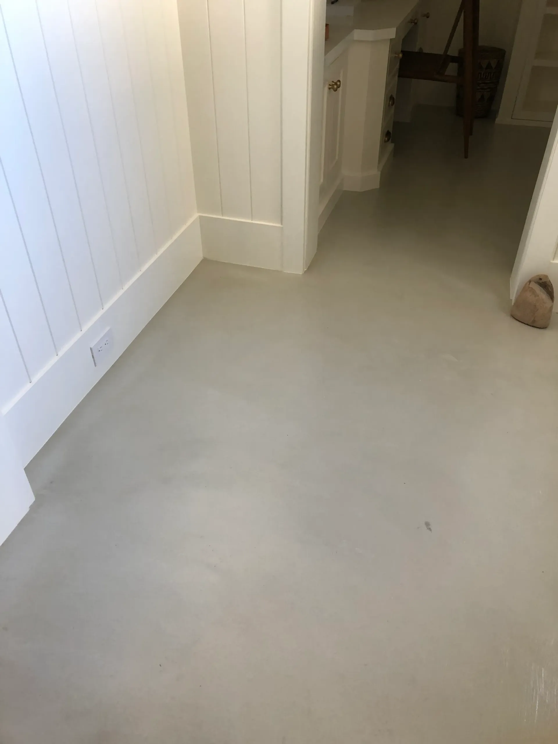 A room with a white floor and white walls.