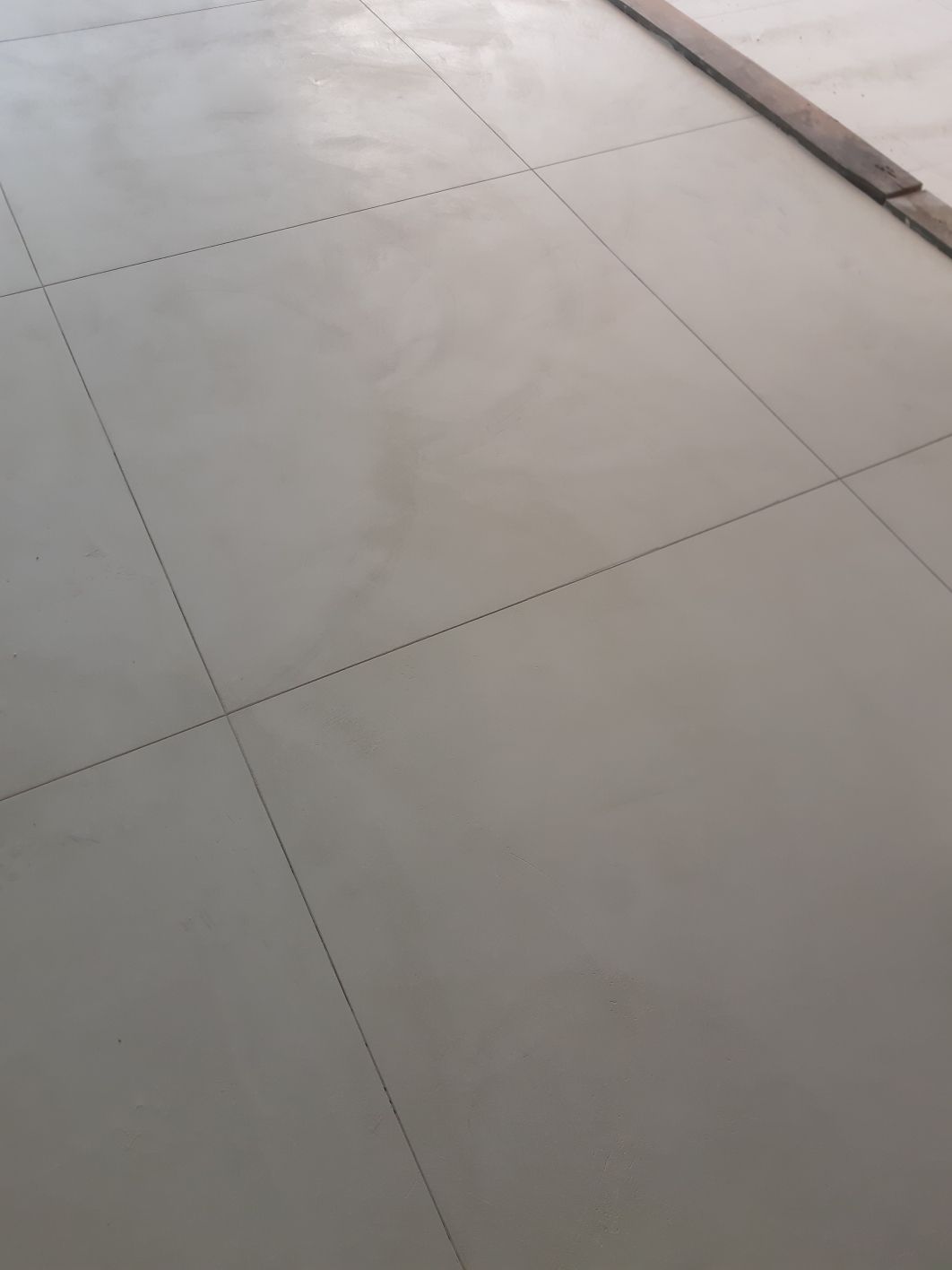 A close up of a tiled floor in a room.