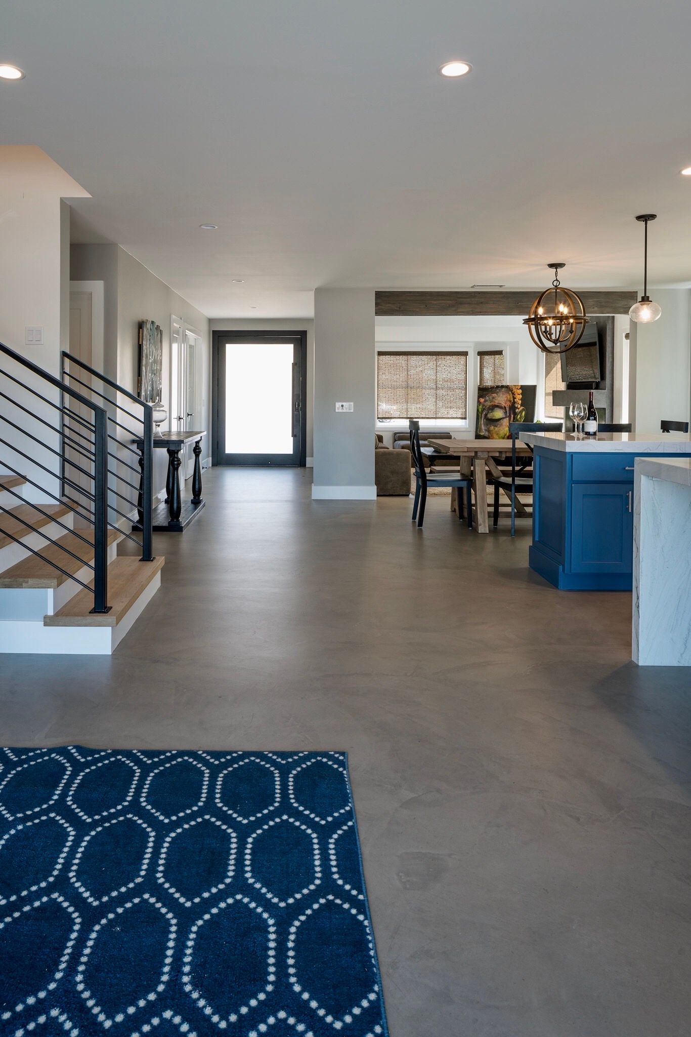 There is a blue rug in the middle of the room.